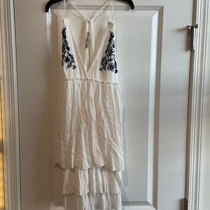 Medium, white sun dress, goes above knee.